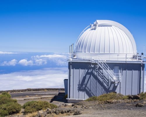 A huge astronomical observatory against the blue sky in Spain