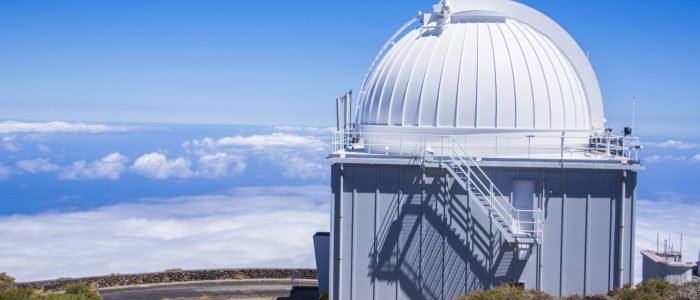 A huge astronomical observatory against the blue sky in Spain